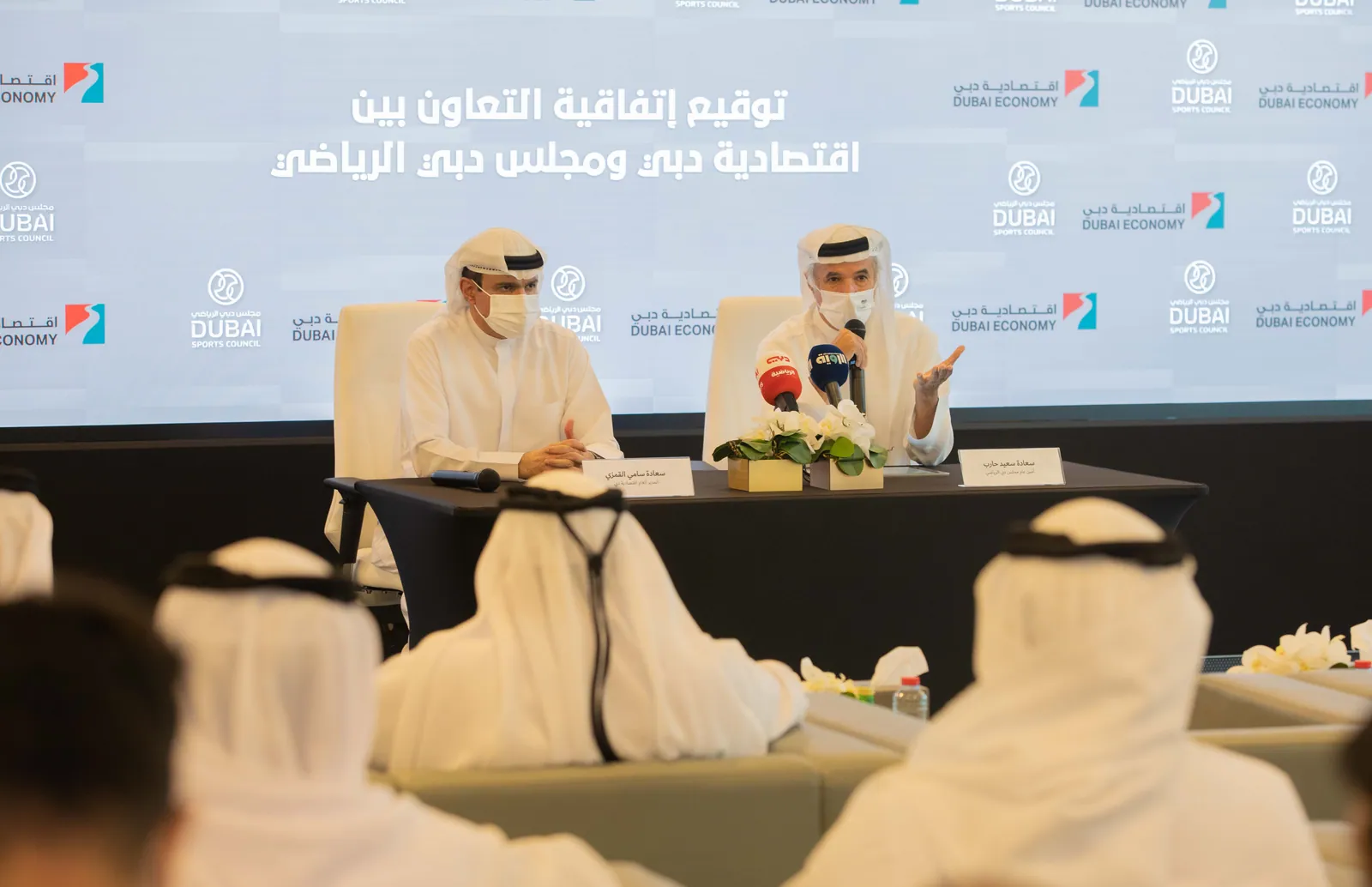 HE Sami Al Qamzi and HE Saeed Hareb during the signing of the agreement.