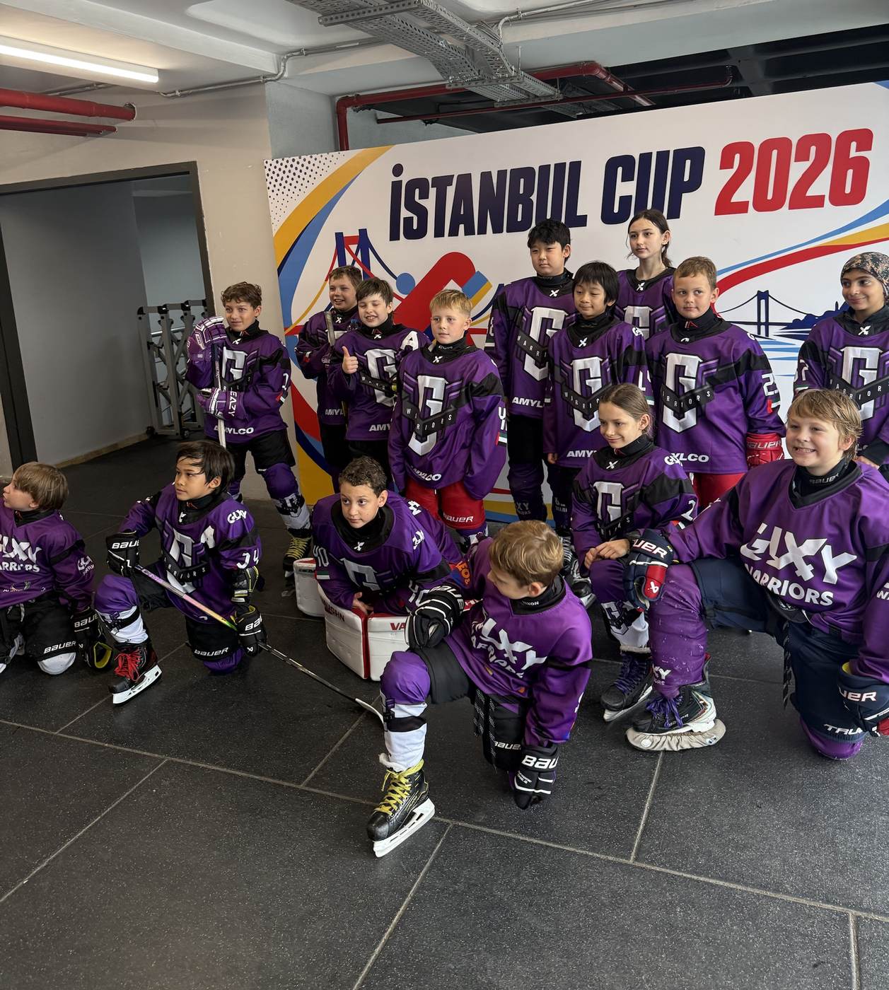 Galaxy Warriors players in their purple kit in front of the Istanbul Cup 2026 board