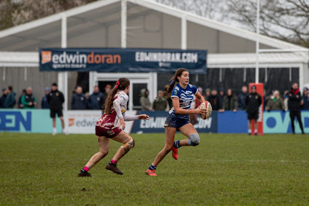 Detail of the JESS Dubai rugby kit featuring J20 Sports performance branding during international competition.