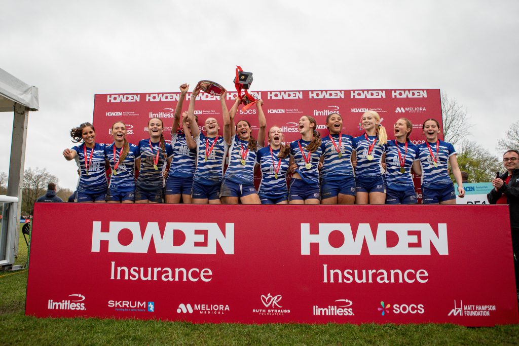 JESS Dubai U16 Girls Rugby 7s team celebrating as National Champions at the Rosslyn Park National Schools 7s tournament.